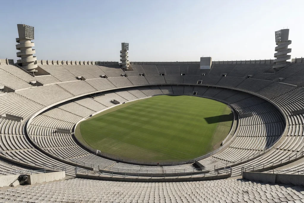 Vast Italian football ground with three concrete tiers and the famous spiral access towers